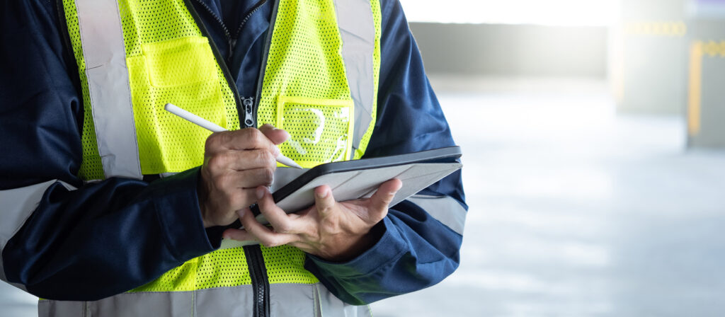 Construction worker using a tablet