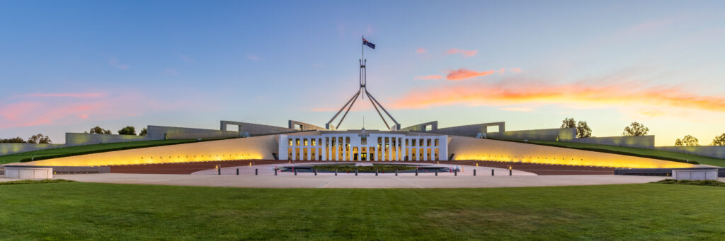 Australian Parliament House at sunset.